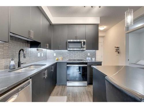 8103-151 Legacy Main Street Se, Calgary, AB - Indoor Photo Showing Kitchen With Stainless Steel Kitchen With Double Sink With Upgraded Kitchen