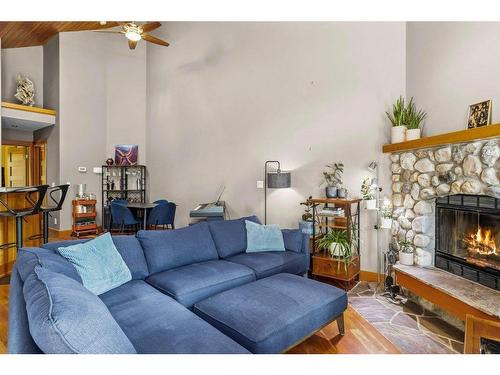 50 Ridge Road, Canmore, AB - Indoor Photo Showing Living Room With Fireplace