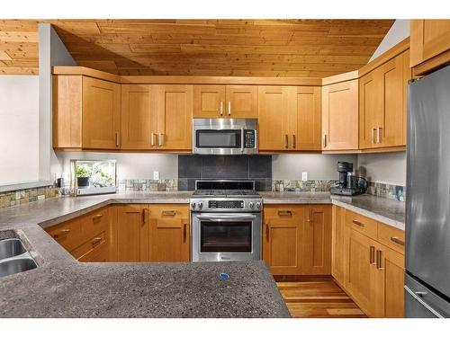 50 Ridge Road, Canmore, AB - Indoor Photo Showing Kitchen With Double Sink