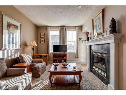 5212-14645 6 Street Sw, Calgary, AB - Indoor Photo Showing Living Room With Fireplace