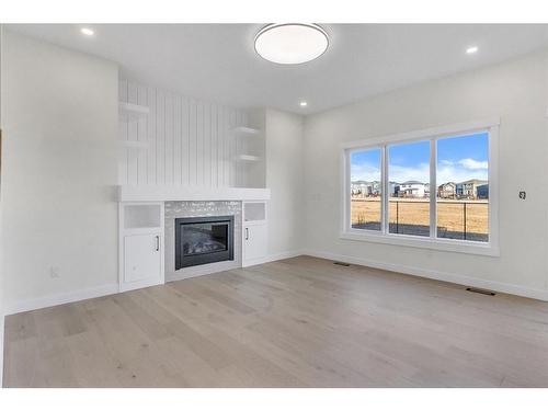 14 Ranchers Meadows, Okotoks, AB - Indoor Photo Showing Living Room With Fireplace