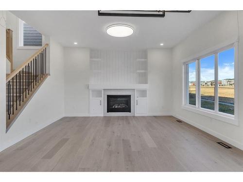 14 Ranchers Meadows, Okotoks, AB - Indoor Photo Showing Living Room With Fireplace