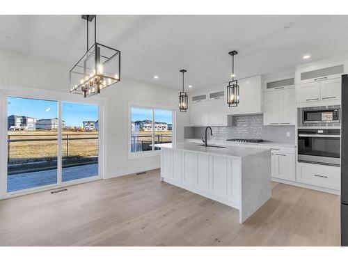 14 Ranchers Meadows, Okotoks, AB - Indoor Photo Showing Kitchen With Upgraded Kitchen