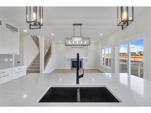 14 Ranchers Meadows, Okotoks, AB - Indoor Photo Showing Kitchen With Double Sink