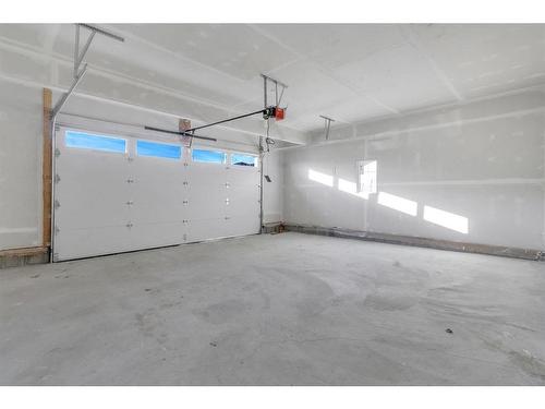 14 Ranchers Meadows, Okotoks, AB - Indoor Photo Showing Garage