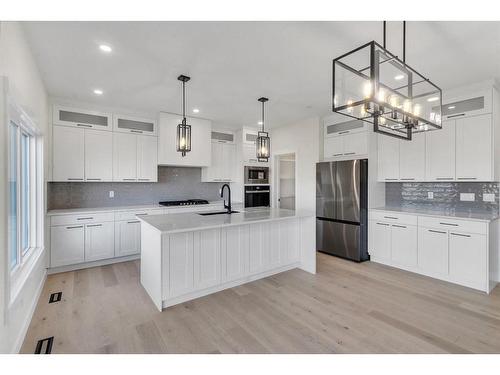 14 Ranchers Meadows, Okotoks, AB - Indoor Photo Showing Kitchen With Stainless Steel Kitchen With Upgraded Kitchen