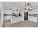 14 Ranchers Meadows, Okotoks, AB  - Indoor Photo Showing Kitchen With Stainless Steel Kitchen With Upgraded Kitchen 