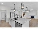 14 Ranchers Meadows, Okotoks, AB  - Indoor Photo Showing Kitchen With Double Sink With Upgraded Kitchen 