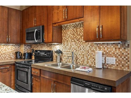 109A/B - Rot D-1818 Mountain Avenue, Canmore, AB - Indoor Photo Showing Kitchen With Double Sink