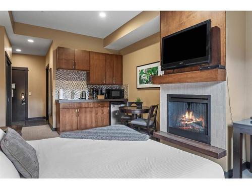 109A/B - Rot D-1818 Mountain Avenue, Canmore, AB - Indoor With Fireplace