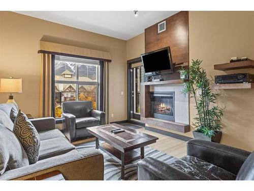 109A/B - Rot D-1818 Mountain Avenue, Canmore, AB - Indoor Photo Showing Living Room With Fireplace