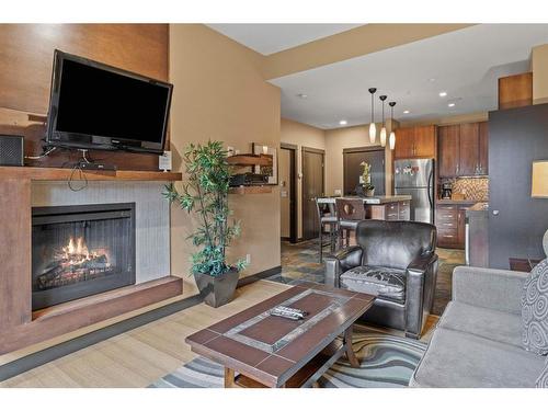 109A/B - Rot D-1818 Mountain Avenue, Canmore, AB - Indoor Photo Showing Living Room With Fireplace