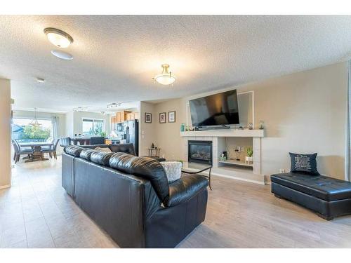 131 Covepark Way Ne, Calgary, AB - Indoor Photo Showing Living Room With Fireplace