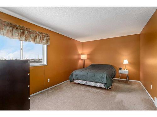 436 Mt Lorette Place Se, Calgary, AB - Indoor Photo Showing Bedroom