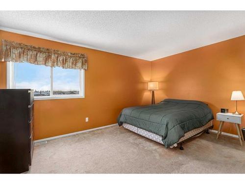 436 Mt Lorette Place Se, Calgary, AB - Indoor Photo Showing Bedroom