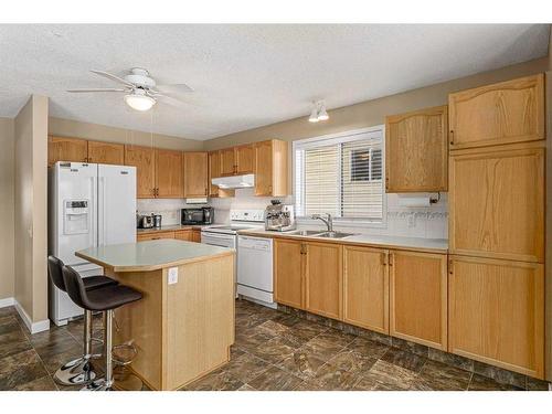 436 Mt Lorette Place Se, Calgary, AB - Indoor Photo Showing Kitchen With Double Sink