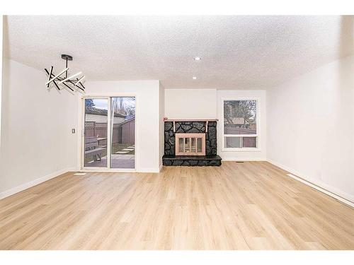 4 Abergale Close Ne, Calgary, AB - Indoor Photo Showing Living Room With Fireplace