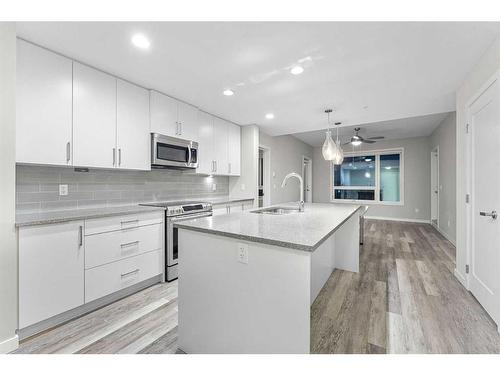 310-8531 8A Avenue Sw, Calgary, AB - Indoor Photo Showing Kitchen With Upgraded Kitchen