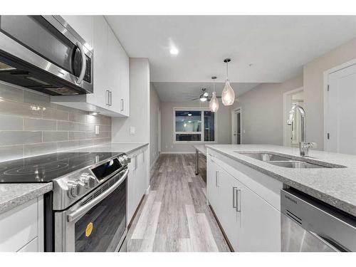 310-8531 8A Avenue Sw, Calgary, AB - Indoor Photo Showing Kitchen With Double Sink With Upgraded Kitchen