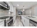 310-8531 8A Avenue Sw, Calgary, AB  - Indoor Photo Showing Kitchen With Double Sink With Upgraded Kitchen 