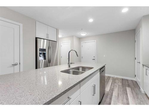 310-8531 8A Avenue Sw, Calgary, AB - Indoor Photo Showing Kitchen With Double Sink