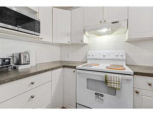 1104-950 Arbour Lake Road Nw, Calgary, AB - Indoor Photo Showing Kitchen