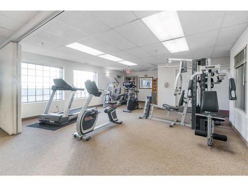 1104-950 Arbour Lake Road Nw, Calgary, AB - Indoor Photo Showing Gym Room