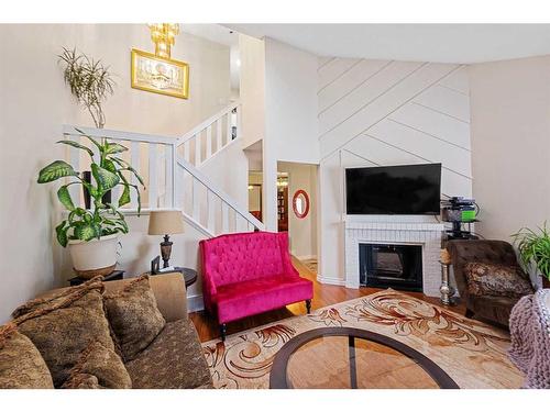 142 Templehill Drive Ne, Calgary, AB - Indoor Photo Showing Living Room With Fireplace