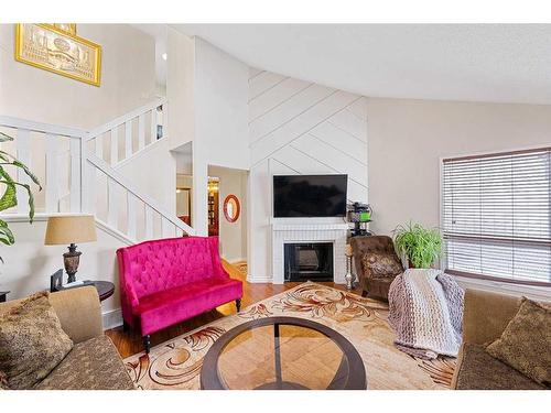 142 Templehill Drive Ne, Calgary, AB - Indoor Photo Showing Living Room With Fireplace