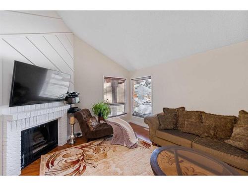 142 Templehill Drive Ne, Calgary, AB - Indoor Photo Showing Living Room With Fireplace