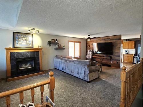 4236 Shannon Drive, Olds, AB - Indoor Photo Showing Living Room With Fireplace