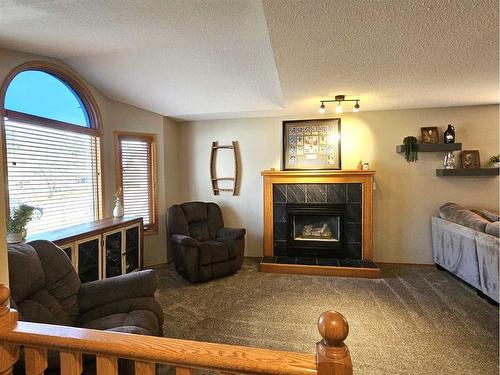 4236 Shannon Drive, Olds, AB - Indoor Photo Showing Living Room With Fireplace