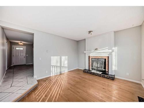 63 Harvest Wood Way Ne, Calgary, AB - Indoor Photo Showing Living Room With Fireplace