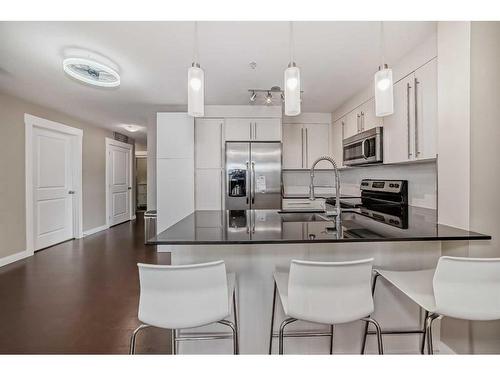 3309-11 Mahogany Row Se, Calgary, AB - Indoor Photo Showing Kitchen With Double Sink With Upgraded Kitchen