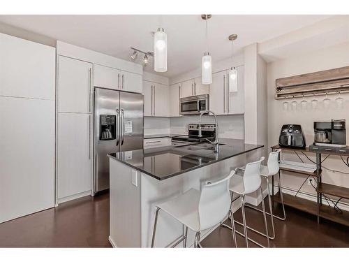 3309-11 Mahogany Row Se, Calgary, AB - Indoor Photo Showing Kitchen With Double Sink With Upgraded Kitchen