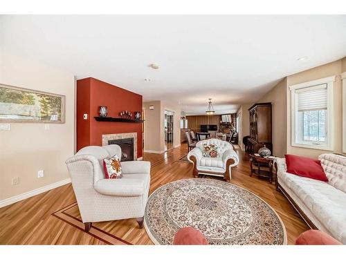 935 Hunterston Hill Nw, Calgary, AB - Indoor Photo Showing Living Room With Fireplace