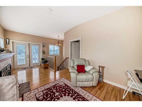 935 Hunterston Hill Nw, Calgary, AB - Indoor Photo Showing Living Room With Fireplace