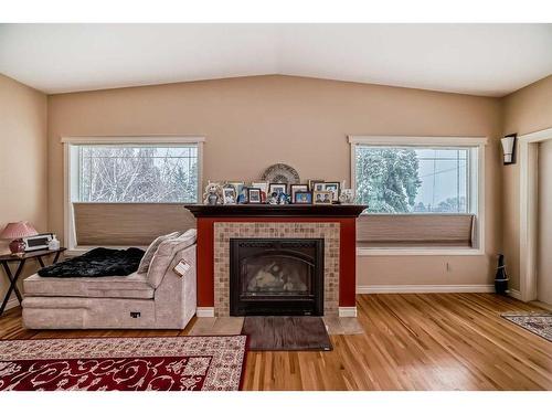 935 Hunterston Hill Nw, Calgary, AB - Indoor Photo Showing Living Room With Fireplace