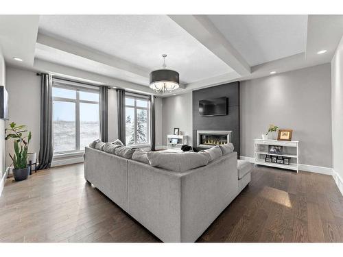 41 Waters Edge Drive, Heritage Pointe, AB - Indoor Photo Showing Living Room With Fireplace