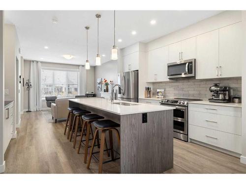 30 D'Arcy Boulevard, Okotoks, AB - Indoor Photo Showing Kitchen With Stainless Steel Kitchen With Upgraded Kitchen