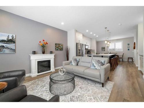 30 D'Arcy Boulevard, Okotoks, AB - Indoor Photo Showing Living Room With Fireplace