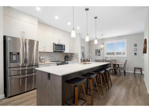 30 D'Arcy Boulevard, Okotoks, AB - Indoor Photo Showing Kitchen With Stainless Steel Kitchen With Upgraded Kitchen