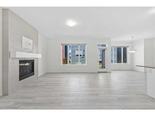 40 Carringham Gate Nw, Calgary, AB - Indoor Photo Showing Living Room With Fireplace