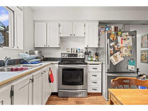 B-133 Park Avenue, Banff, AB - Indoor Photo Showing Kitchen With Double Sink