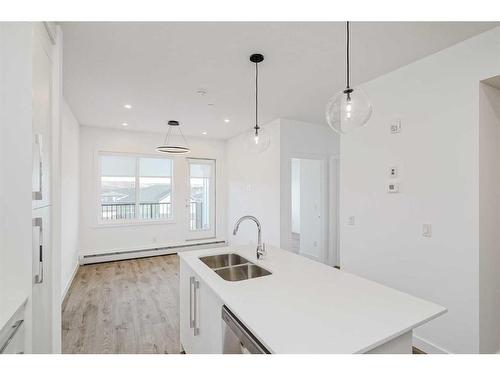 4307-111 Wolf Creek Drive Se, Calgary, AB - Indoor Photo Showing Kitchen With Double Sink With Upgraded Kitchen