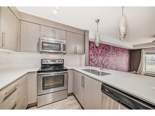 2103-302 Skyview Ranch Drive Ne, Calgary, AB - Indoor Photo Showing Kitchen With Stainless Steel Kitchen With Double Sink