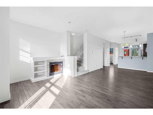 718 Walden Circle Se, Calgary, AB - Indoor Photo Showing Living Room With Fireplace