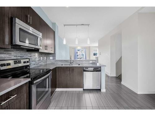 718 Walden Circle Se, Calgary, AB - Indoor Photo Showing Kitchen With Stainless Steel Kitchen With Double Sink With Upgraded Kitchen