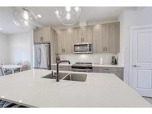 607-355 Nolancrest Heights Nw, Calgary, AB - Indoor Photo Showing Kitchen With Stainless Steel Kitchen With Double Sink With Upgraded Kitchen