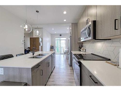 607-355 Nolancrest Heights Nw, Calgary, AB - Indoor Photo Showing Kitchen With Double Sink With Upgraded Kitchen